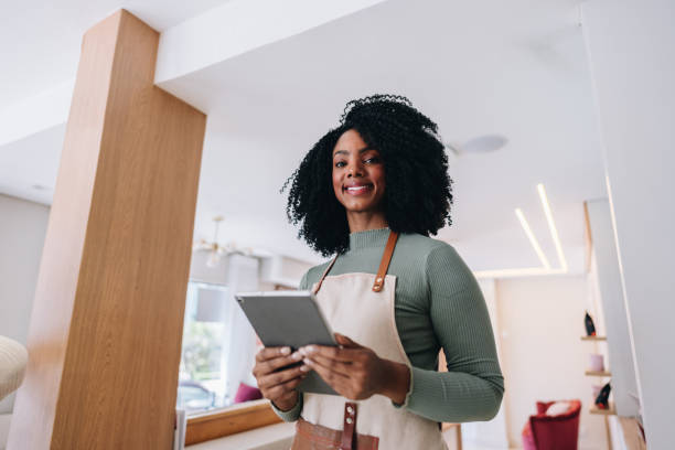 istock Portrait of a owner using digital tablet at coffee shop 1885002753