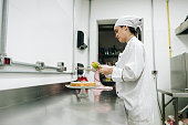 Chef preparing a lemon pie in the comercial kitchen at restaurant