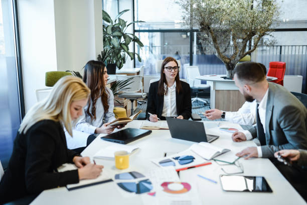 istock Female Team Leader In Company Asking For Ideas On New Project 1885010226