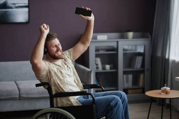 istock Man with Disability Dancing in Wheelchair 1885055516