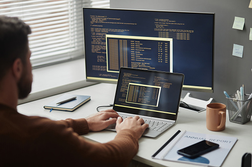 Programmer Using Computer In Office And Writing Code Stock Photo ...