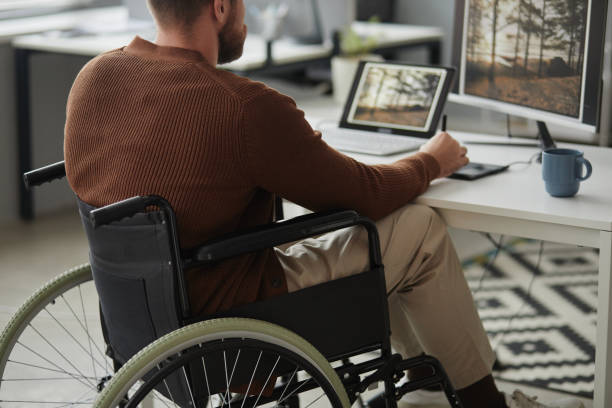 istock Close Up of Man with Disability Working as Photo Editor 1885056054