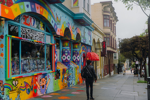March 19, 2023: walking the famous Haight-Ashbury district of San Francisco, California with colourful stores, restaurants and boutiques during rainy day