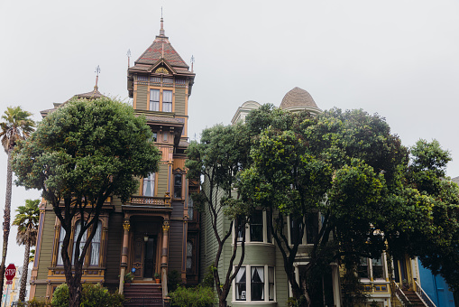 March 19, 2023: walking the famous Haight-Ashbury district of San Francisco, California with authentic old houses during rainy day