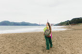 Woman with Backpack Contemplating Baker Beach in San Francisco, California
