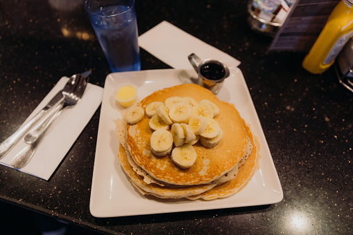 A view of American Pancakes with bananas in the morning cafe of San Francisco, the United States