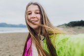Selfie of Happy Woman Contemplating Baker Beach in San Francisco, California