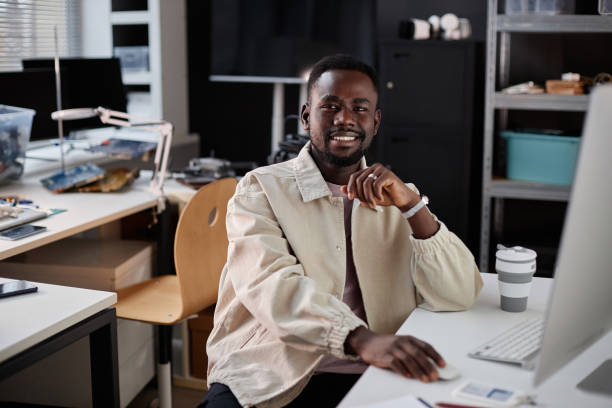 istock Black man in tech repair shop 1885076698