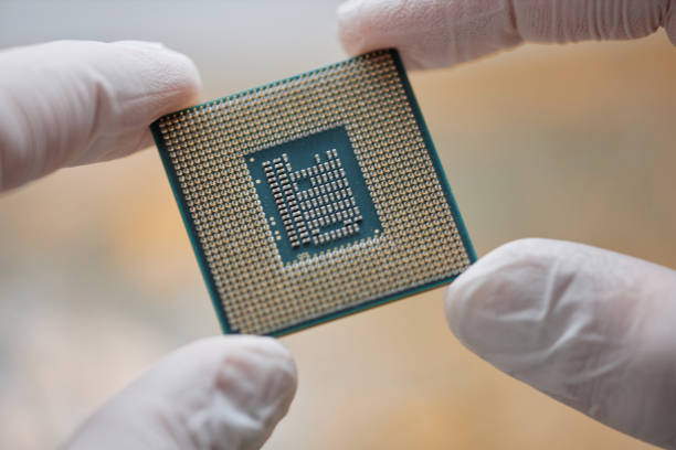 istock Extreme of Gloved Hands Holding CPU Chip 1885077765