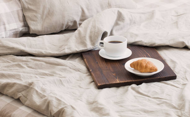 istock coffee on  tray on the bed in bedroom 1885117492