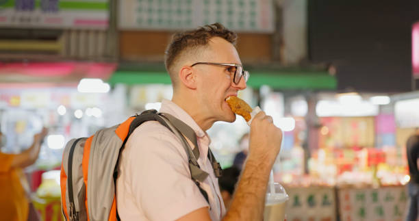 istock man visit the night market 1885118031