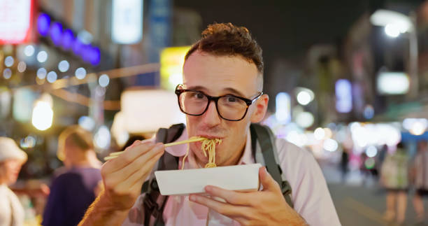istock man visit the night market 1885119593
