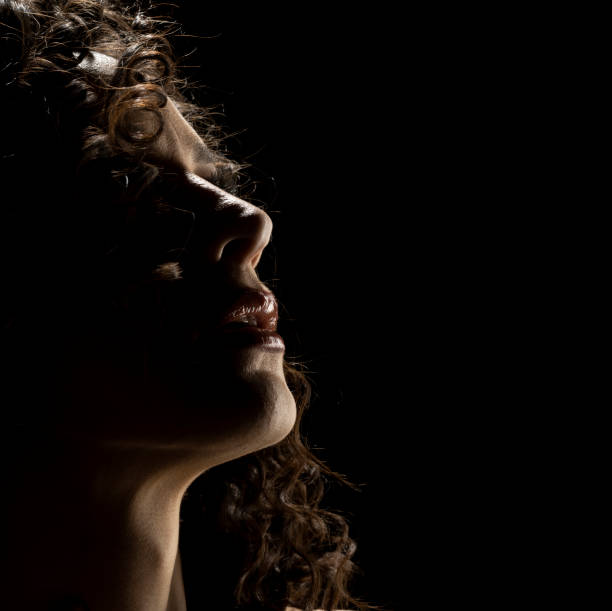 istock Sensual Profile Silhouette Portrait on Dark Background 1885136279