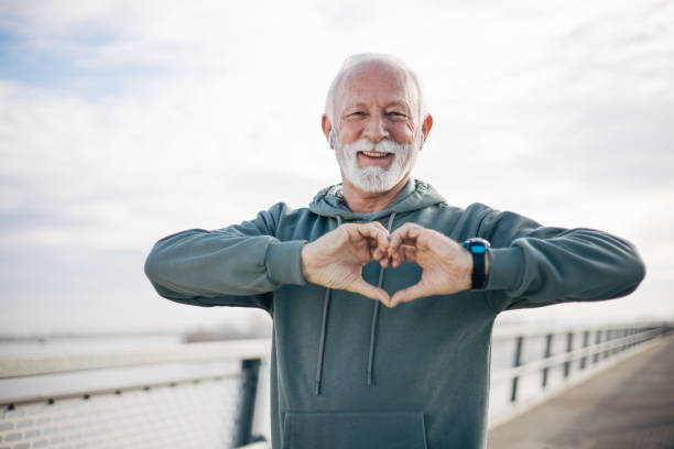 istock A senior man making a heart symbol with his hands 1885139872
