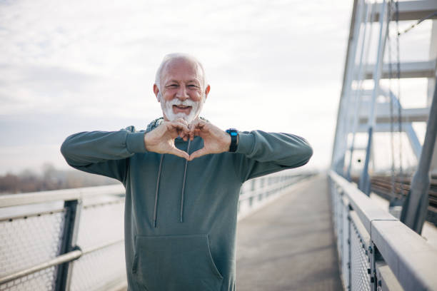 istock A senior man making a heart symbol with his hands 1885139873