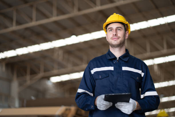 istock Portrait Caucasian businessman workers using tablet computer checking Kraft paper stock in warehouse 1885170451