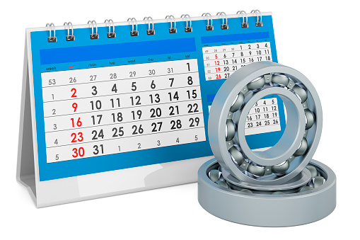 Ball bearings with desk calendar, 3D rendering isolated on white background