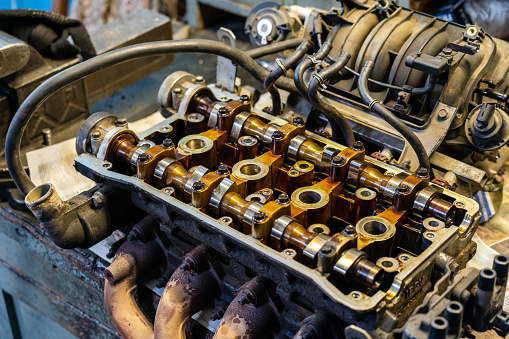 Cylinder head combustion engine with camshafts. Automotive, repair servicing.