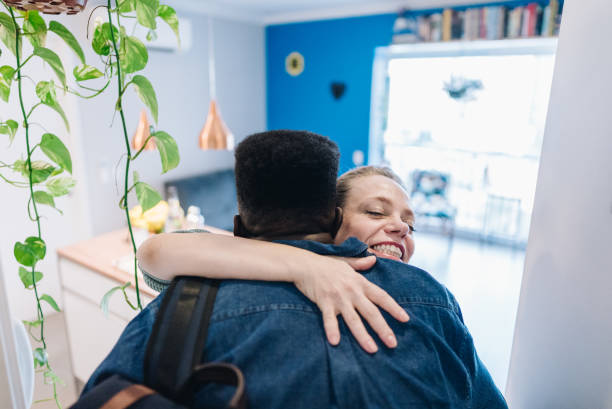 istock Friends embracing at home 1885223914