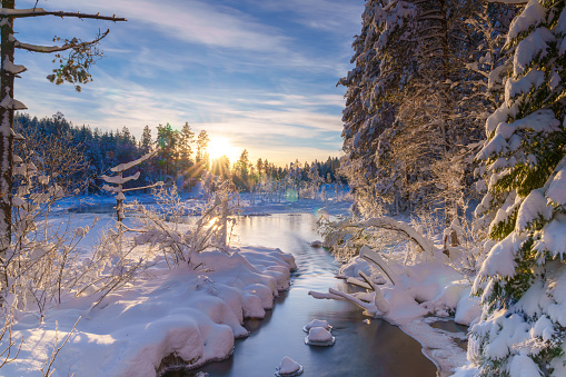 a stream in the snowy landscape, snow-covered landscape, winter fairytale landscape