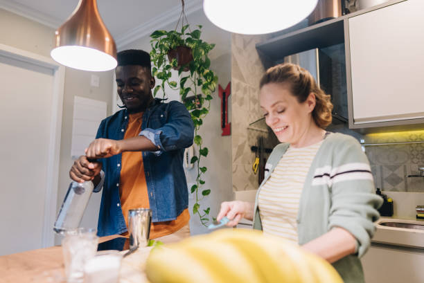 istock Friends preparing drinks in the kitchen at home 1885227067