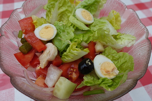 Seasoned salad composed of quail eggs tomato Paris mushrooms pickle