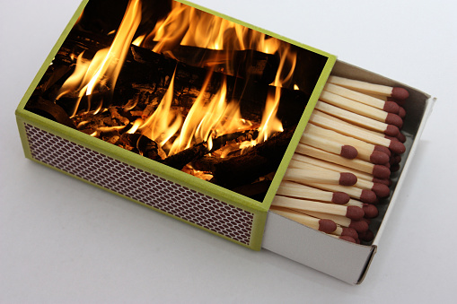 Box of matches with an image of a fireplace fire