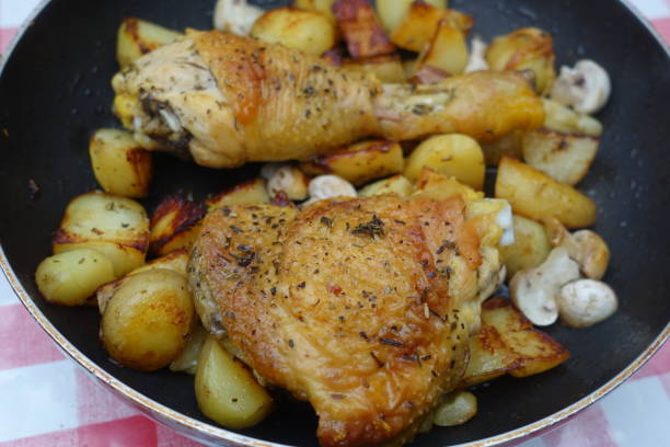 istock Aromatic plant-roasted chicken leg with garlic hash browns 1885242025