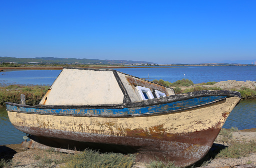 Old Wooden Turkish Fishing Boat by the Mediterranean Sea with Beautiful Blue Sky in Yumurtalik, Adana, Turkey