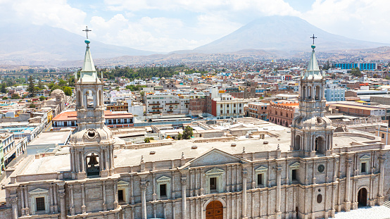 Aerial view of Basílica Catedral at Plaza de Armas in Arequipa with Cachani volcano on the background