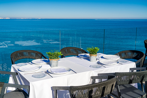 White dining table by the ocean