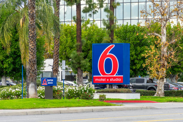 Signage for Motel 6 Ontario, CA, USA - November 30, 2023: Signage for Motel 6, Motel plus Studio, located on Vineyard Ave in Ontario, California. motel stock pictures, royalty-free photos & images