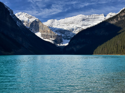 Medium shot of Canada's Lake Louise framed by its snowcapped mountains