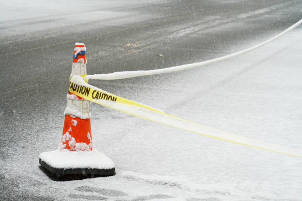 istock traffic cone on the street after snow 1885345004