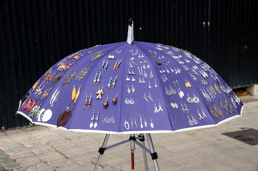 Madrid, spain may, 5 2018, White parasol and hand fan on garden grass