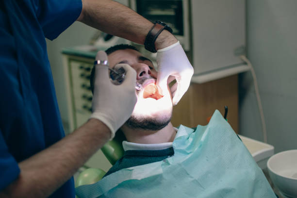 istock giving anesthesia for treatment and tooth extraction 1885384856