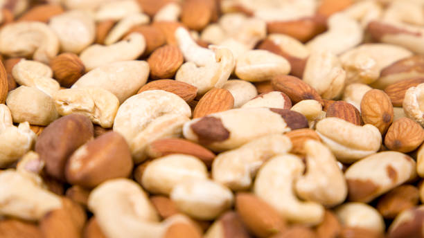 istock Background of nuts, almonds, cashews, Brazil nuts. Selective focus. 1885387452