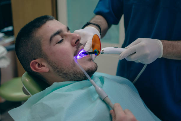 istock bonding dental fillings with a UV lamp 1885391117
