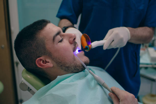istock bonding dental fillings with a UV lamp 1885393754