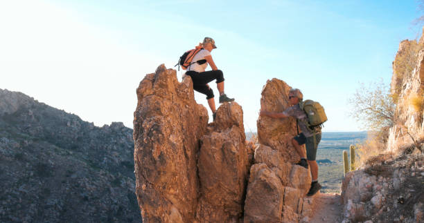 achievement concept, climber on top of the mountain