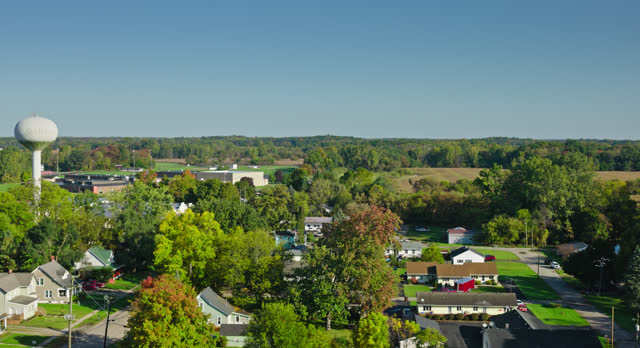 Ascending Aerial of Small Town in Michigan on Clear Day