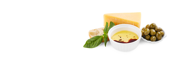Balsamic vinegar with oil, olives, cheese and bread on white background, space for text. Banner design