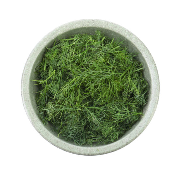 istock Bowl of fresh dill isolated on white, top view 1885434813