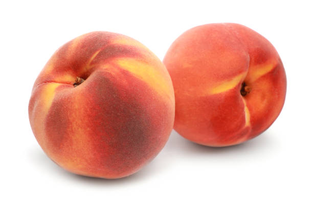 istock Delicious fresh ripe peaches isolated on white 1885435852