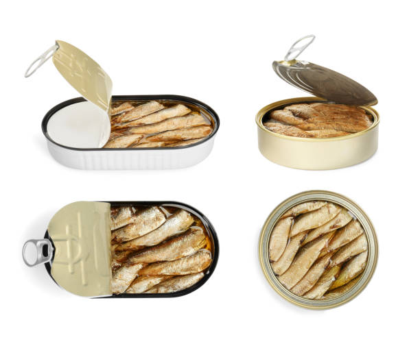 istock Tasty sprats in tin cans isolated on white, set with top and side views 1885437431