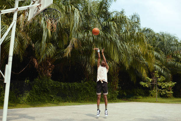 istock Streetball Player Throwing Ball 1885437432