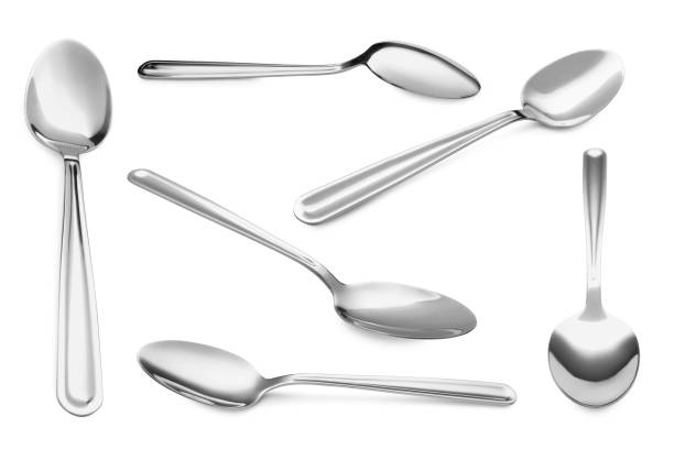 istock Silver spoon isolated on white, different sides. Kitchen utensil 1885437439