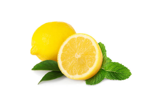 istock Fresh lemons and green mint isolated on white 1885450042