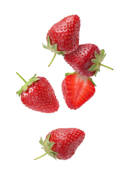 istock Fresh ripe strawberries falling on white background 1885451616