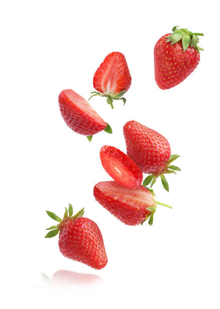 istock Fresh ripe strawberries falling on white background 1885452683